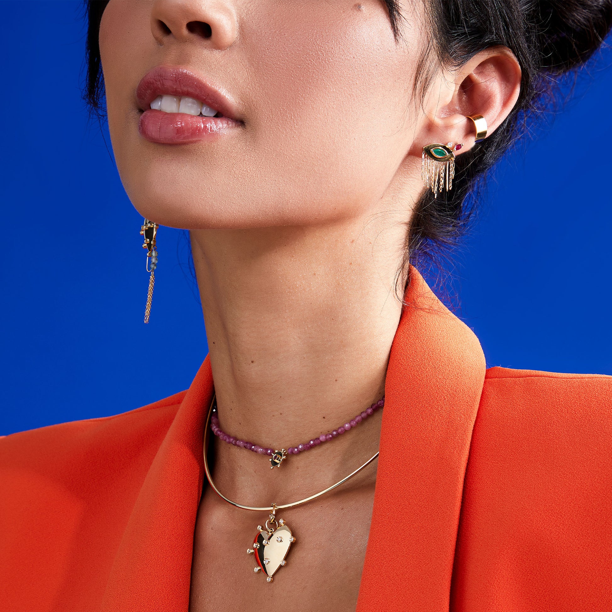 BRINCO OLHO GREGO FRANJAS COM ESMERALDA E RUBI